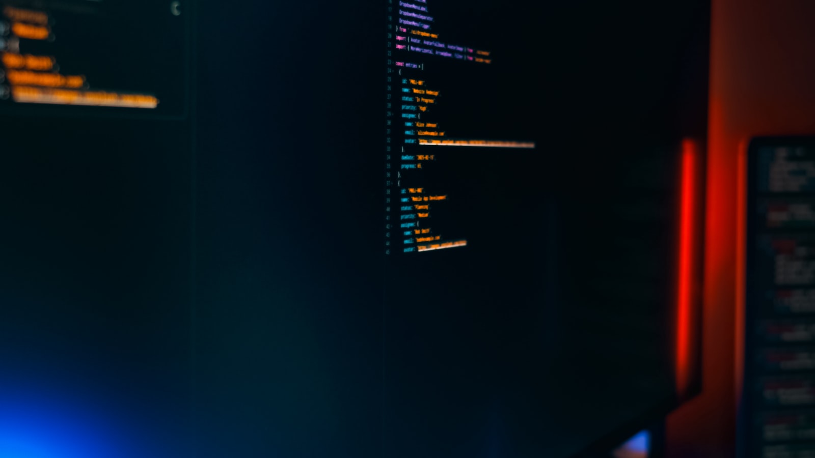 Frontend developers working around laptops in a workspace